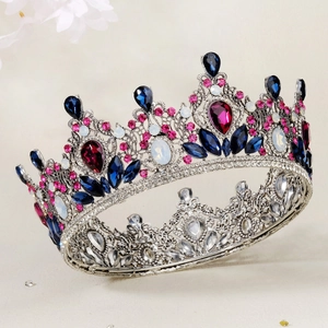 Macro shot of colorful rhinestones and intricate silver metalwork on a Baroque bridal crown