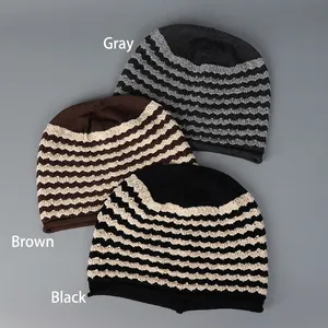 Three knitted slouchy beanies in grey, coffee and black with wavy texture design