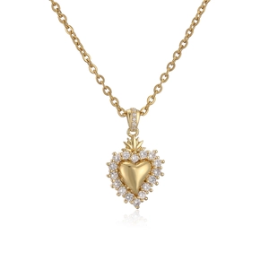 Gold plated heart pendant necklace with clear zircon stones on a white studio background