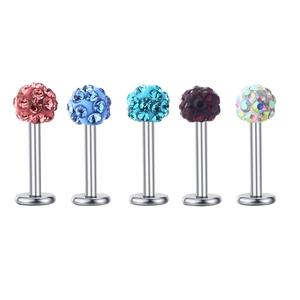 Detail view of five assorted colorful rhinestone labret studs with flat back metal posts