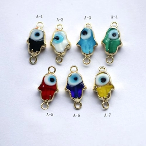 Seven colorful Hamsa Hand and Evil Eye enamel connectors for DIY jewelry making