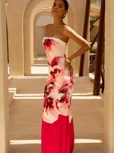Elegant strapless bodycon maxi dress with bold red floral print on white background