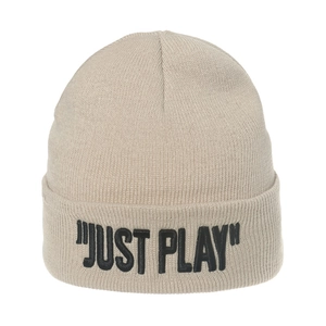Detail of beige knit beanie featuring black Just Play embroidery and ribbed texture