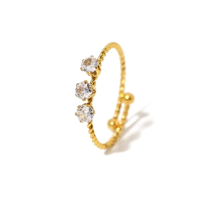Elegant gold twisted rope ring with three sparkling round zircons in a classic setting