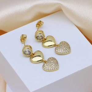 18k gold plated copper heart earrings with sparkling cubic zirconia on silk background