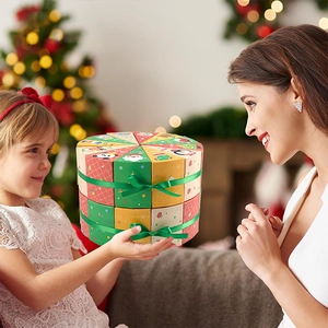 Double-layer round Christmas advent calendar gift boxes with festive illustrations and ribbon