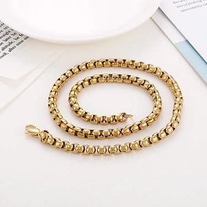 Macro shot of 18K gold plated stainless steel box chain necklace with lobster clasp