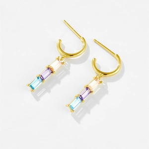 Macro shot of 925 silver gold-plated earrings with colorful vertical square zircons