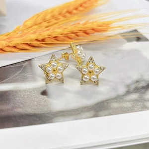 18k gold plated star earrings featuring white pearls and sparkling zircon accents
