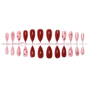 Almond cat eye press-on nails with red bows, pearls, and heart patterns in a 24-piece set