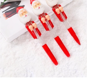 Three red Christmas Santa Claus boxing pens displayed on white soft faux fur carpet