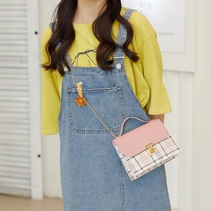 Pink checkered plaid crossbody bag with metal chain strap and cute flower charm accessory