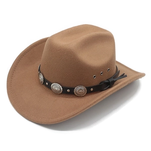 Detail of brown wool cowboy hat with black leather band and silver embossed buckles