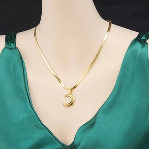 Elegant 18K gold plated flat snake chain necklace with a polished crescent moon pendant