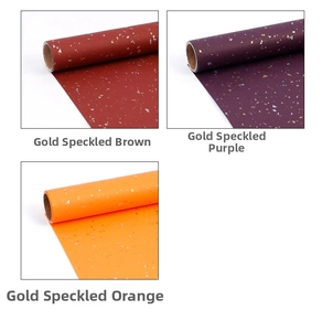 Detail of gold foil wrapping paper rolls in brownish red, purple, and orange colors