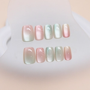 Pink and mint green cat eye gradient short ballet press-on nails on acrylic display