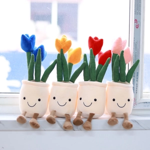 Detailed view of four colorful tulip plush pots with cute smiling faces on marble