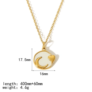 Detail of 18k gold plated necklace with crescent moon and heart pendant on white enamel