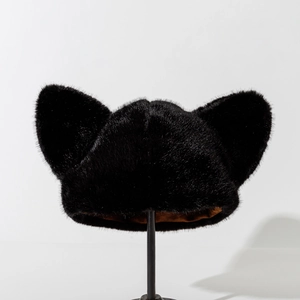 Detailed view of plush cat ear hat in black faux fur with a soft inner lining
