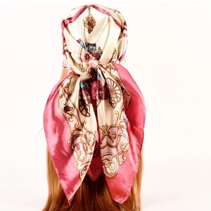 Detail of silk satin scarf used as headband showing vintage carriage print and pink border