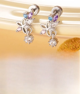 Detail of silver butterfly stud earrings with colorful zircon and titanium steel posts