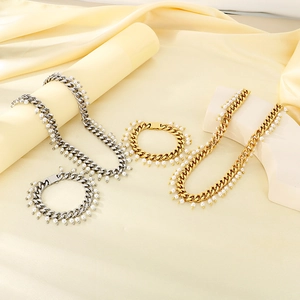 Elegant gold and silver 9mm Cuban chain jewelry set with pearl pendants on silk