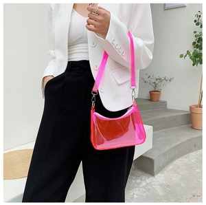 Shoulder view of pink transparent jelly handbag with stylish PVC texture and chic strap