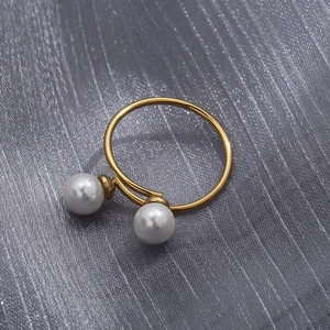 Detailed macro view of 18K gold-plated double pearl open ring with polished finish