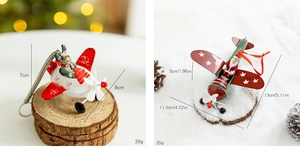 Detailed size comparison of iron Christmas airplane ornaments with reindeer and Santa
