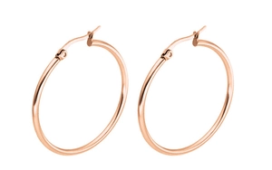 Macro shot of rose gold hoop earrings with polished finish and secure clasp closure