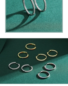 Detail of S925 silver hoop earrings with pavé set rainbow and clear zircon stones