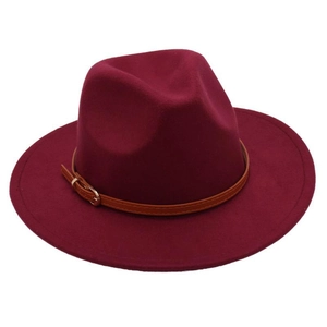 Detail of burgundy wool fedora hat featuring a brown leather band and metal belt buckle