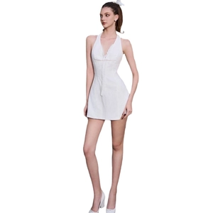 Elegant white halter mini dress with lace trim and V-neck for summer fashion look