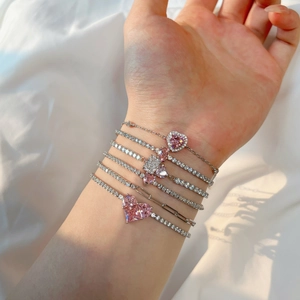 Detail of S925 silver multi-layer tennis bracelet with pink heart cubic zirconia