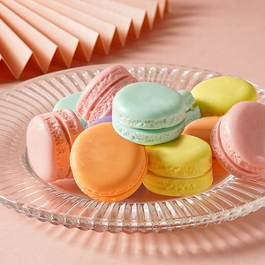 Pastel artificial macaron dessert models on glass tray for photography props