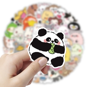 Close-up of a cute cartoon panda eating bamboo sticker with a blurred background