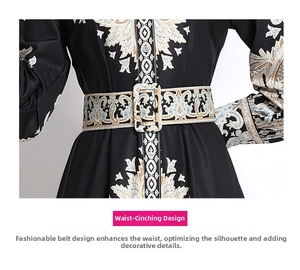 Detailed view of paisley print dress waistline with matching wide belt and buckle