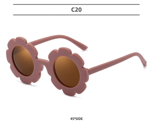 Detailed 45-degree side view of matte dusty pink flower shaped kids sunglasses