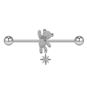 Detail of silver bear cartilage piercing with sparkling zircon stones and star pendant