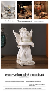 Detailed view of hand-carved resin angel candle holder with a clear glass candle bowl