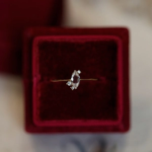 Elegant 925 sterling silver marquise cut diamond ring on a luxury red velvet box