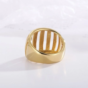 Macro shot of minimalist hollow gold stripe ring with vintage openwork design