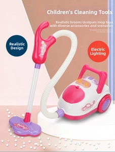 Close-up of pink toy vacuum cleaner with glowing lights and simulation cleaning beads