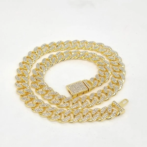 Detailed close-up of 12mm gold Cuban link necklace with full diamond pave and square clasp