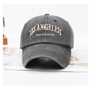Detailed embroidery of LOS ANGELES and VINTAGE MADE on a washed grey cotton baseball cap