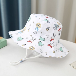 Detail of kids bucket hat with animal patterns and adjustable white chin strap