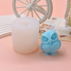 Owl-shaped silicone mold and 3D owl cake topper with detailed feather texture