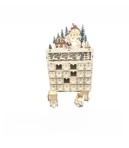 Detailed laser-cut wooden advent calendar featuring 24 drawers and a winter village scene