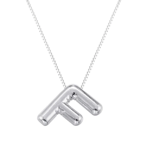 Close-up of polished silver balloon letter F pendant on a delicate box chain necklace