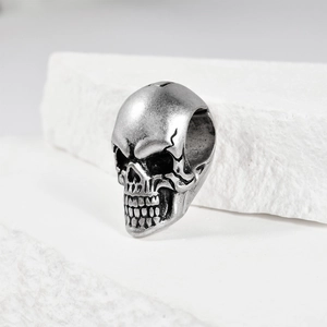 Macro shot of vintage skull charm in antique silver finish with oxidized metal details